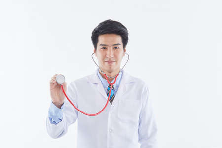 Covid-19, preventing the virus, healthcare workers, and preventing virus concept. Friendly looking smiling Asian male doctorの写真素材