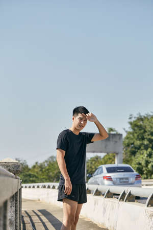 Good looking handsome young Asian girls exercising in the city