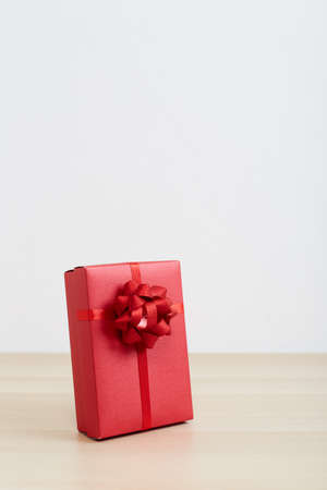 Christmas presents Red gift box on the wood floor Merry Christmas and Happy New Yearの写真素材
