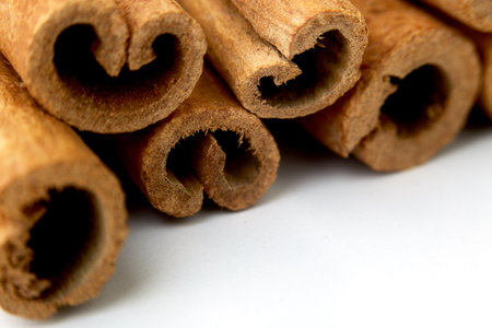Close up cinnamon sticks isolated on white backgroundの写真素材