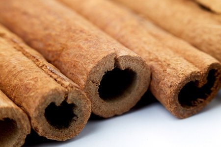 Close up cinnamon sticks isolated on white backgroundの写真素材
