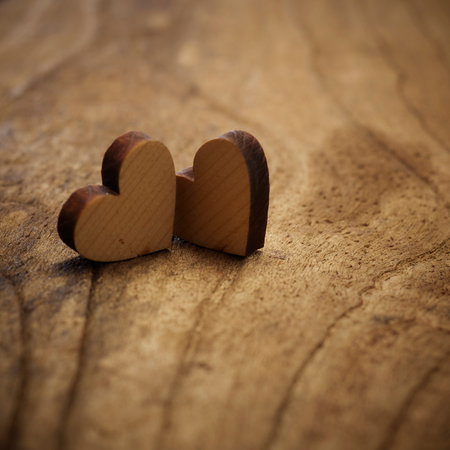 two wood heart on wooden floor background copy space for textの写真素材