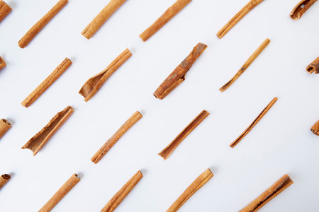 Closely fragrant cinnamon sticks isolated on white backgroundの写真素材