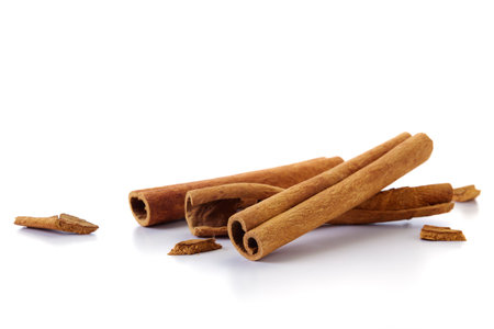 A heap of cinnamon sticks on white backgroundの写真素材