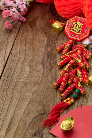Good luck firecrackers Chinese new year or lunar new year 2021 decoration on Wooden table (Chinese character "fu" meaning fortune)の写真素材
