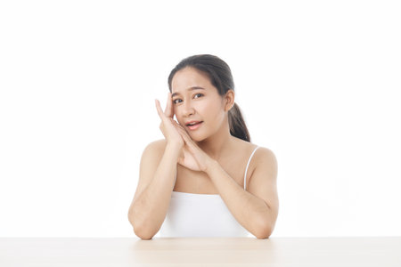 Beautiful Asian woman looking at camera smile with clean and fresh skin, Face care, Facial treatment, Cosmetology, beauty, and spa, Asian women portrait on white background, cosmetics conceptの写真素材