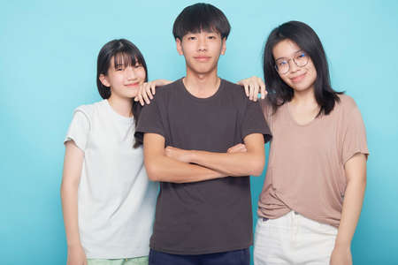 Group of happy friends on a blue background. Friendship concept. friendship and teamwork conceptの写真素材