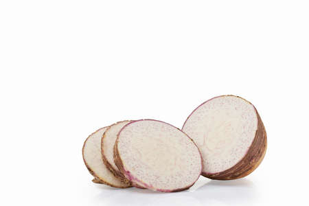 Close Up of Fresh Sliced of taro isolated on white background, Front view, Clipping pathの写真素材