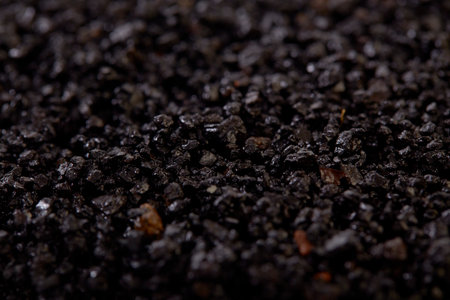 Organic fertiliser humic granules background texture