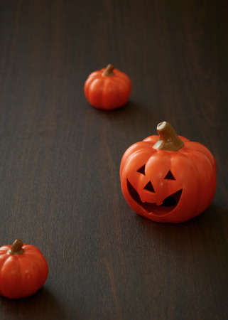 Halloween pumpkin on old wooden backgroundの写真素材