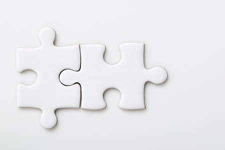 Blank jigsaw puzzles piece isolated on white backgroundの写真素材