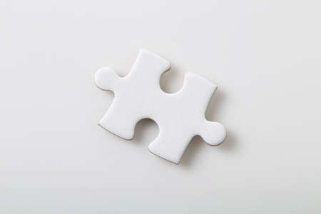 Blank jigsaw puzzles piece isolated on white backgroundの写真素材