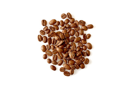 Above roasted coffee beans isolated on white background. copy space for textの写真素材