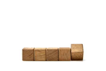 Wooden toy cube blocks with empty copy space for message word on white backgroundの写真素材