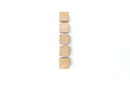 Wood cube blocks with empty copy space for message word on white background. mock-up top view layoutの写真素材