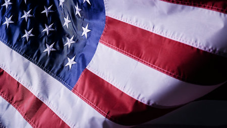 A closeup shot of the waving flag of the United States of America with interesting texturesの写真素材