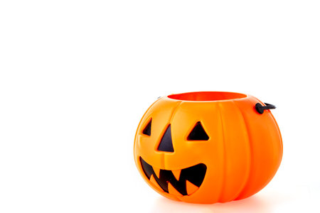Halloween Jack o Lantern Pumpkin with a spooky face on a white backgroundの写真素材