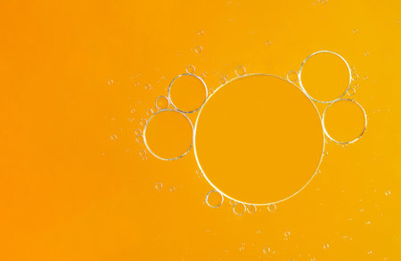 Top view of oil bubble on the water with colorful gradient background. Abstract macro of circles oil drop on the water surface. Bright photography used as wallpaper. Selective focus on bubble.の写真素材