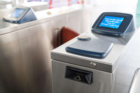 Selective focus of modern automatic ticket machine at sky train station. Access control passenger for transportation concept. Entrance to station. Transportation system in the central city.の写真素材