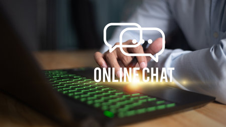 men's hand typing on keyboard laptop with mobile smartphone, Live Chat Chatting on application Communication Digital Web and social network Conceptの写真素材