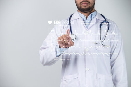 Mid section of male doctor touching icon of media screen on grey backgroundの写真素材