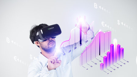 Young man in virtual reality headset touching graphs and symbols on virtual screenの写真素材