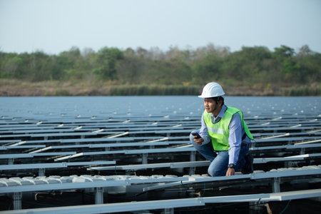 Engineer or technician working on solar panel in solar power plant.の写真素材