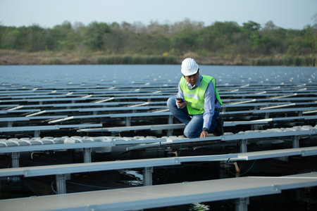 Engineer or Technician working in solar power plant for clean energy.の写真素材