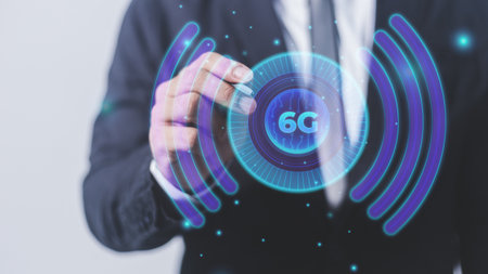 Businessman on blurred background drawing 5G network hologram 3D renderingの写真素材