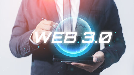 businessman holding a smartphone with hologram web 3.0 digital technology.の写真素材