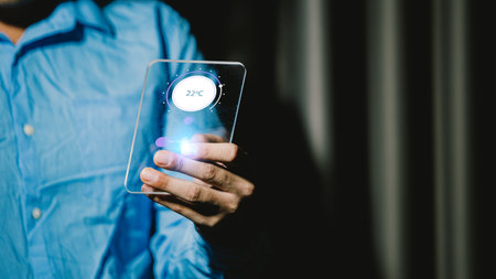 Close up of a man holding a smartphone with a text on the screen