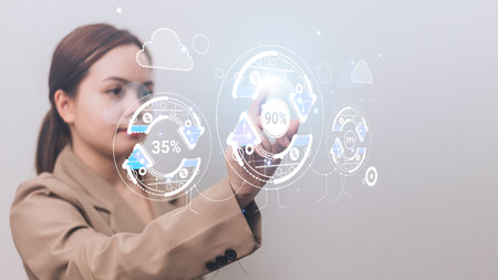 Businesswoman touching hologram screen with virtual icons on it. Business conceptの写真素材