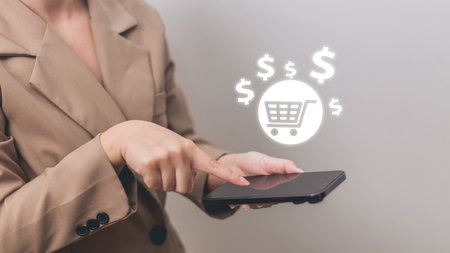 Woman using smartphone with shopping cart icon. Online shopping and e-commerce concept.