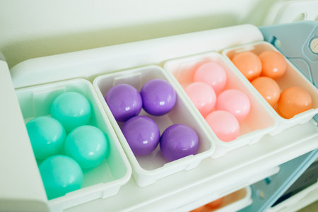 Colorful easter eggs in plastic egg box. Selective focus.