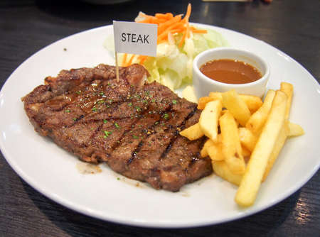 Beef steak with french friesの写真素材