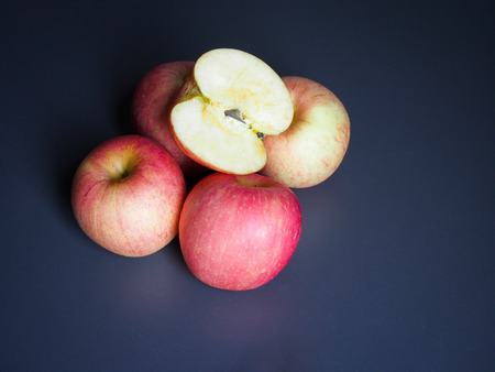 Fresh apples, dew, light, and shadowの写真素材