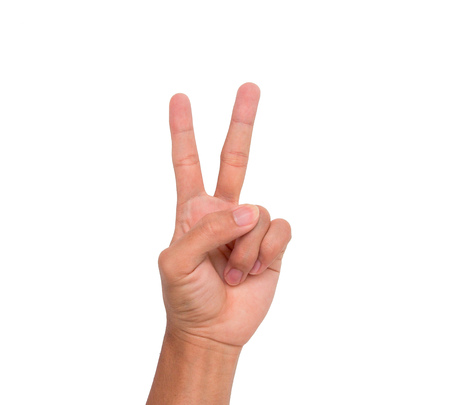 A hand sign 2 fingers point upward meaning two, second, etc. with white backgroudの写真素材