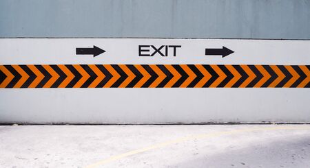 Turn right to exit, sign on the wallの写真素材