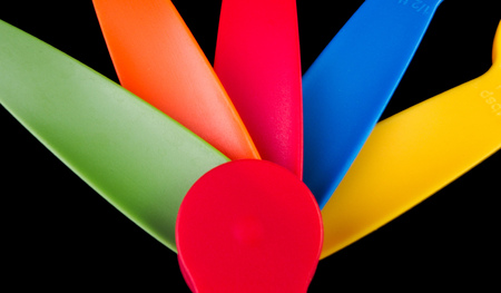 Set of expanding measuring spoon isolated against black backgroundの写真素材