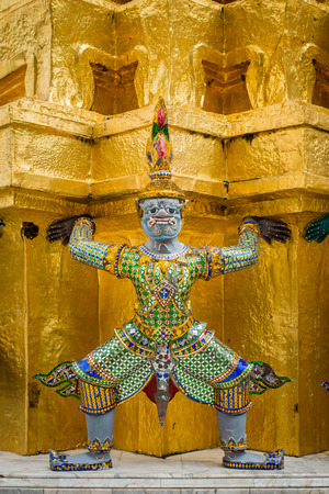 Demons which supports the golden chedi in wat phra kaewの写真素材