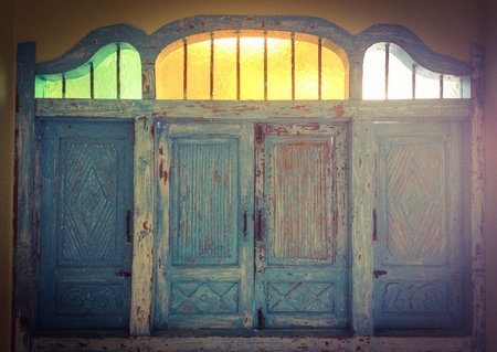 blue windows on the wall with glass