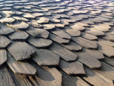 Traditional wooden roof tile of old houseの写真素材
