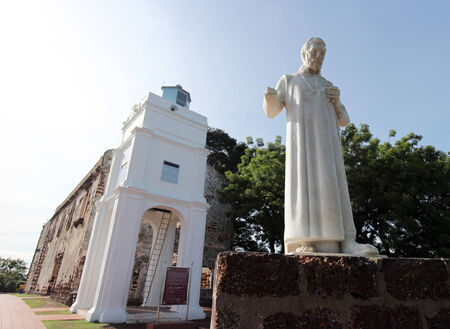 Exterior view of St. Paul's Church in Malacca, Malaysia with a statue of St. Francis Xavier in frontの写真素材