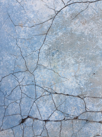 background with old rough antique wall terracotta with cracks and splitsの写真素材