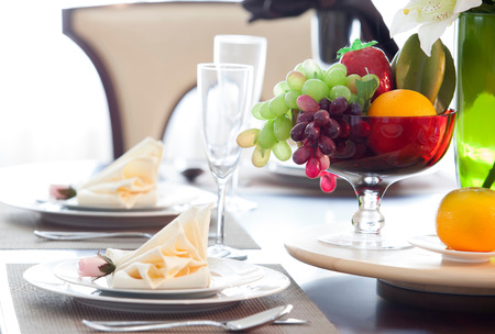 The beautiful artificial fruits in a basket and dish set for decoration