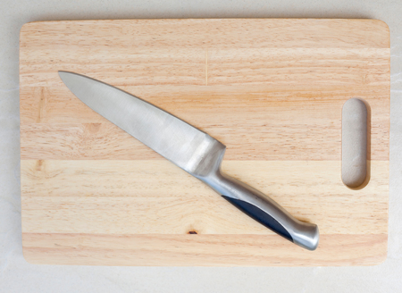 cutting board knife placed on wooden boards