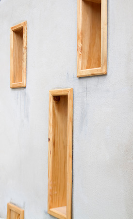 cement wall with wooden windowsの写真素材