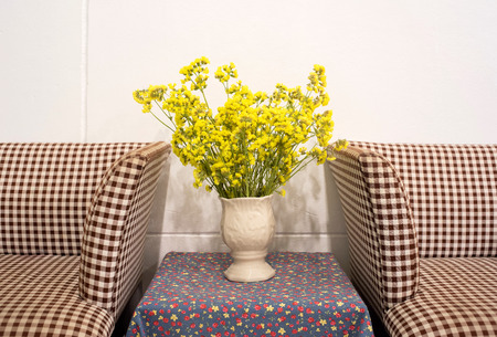 Beautiful summer flowers in vases near the chairの写真素材