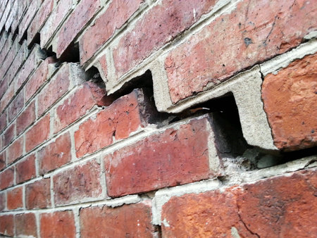 Red brick wall with crack