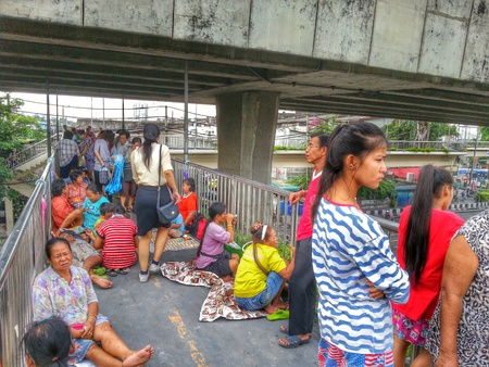 Bangkok, Thailand - August 7, 2014 : Many people are waiting for donations on the overcrossing.のeditorial素材